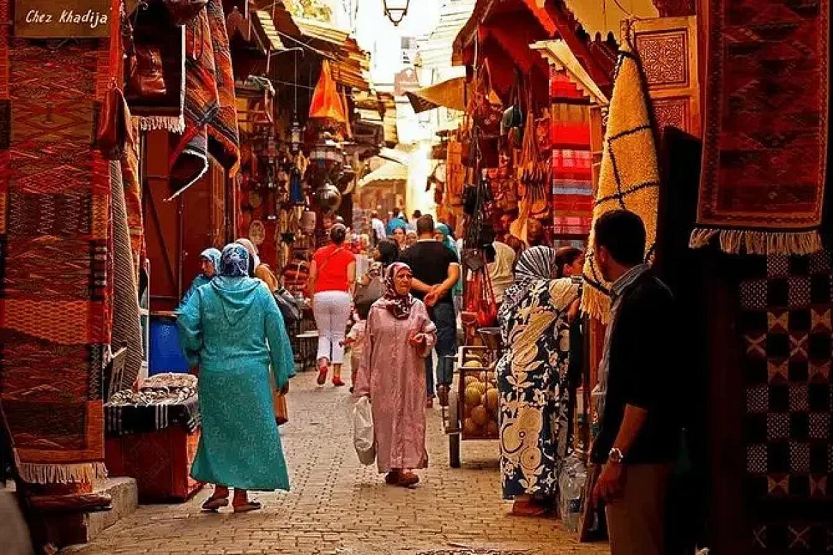 Carpets on display in a Fes medina souk