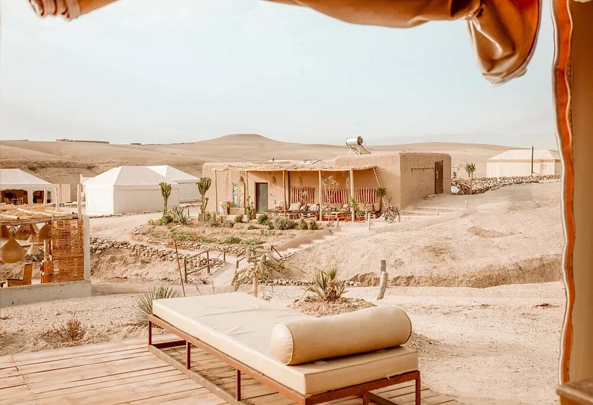 Lounge terrace and tents of a desert camp in the Agafay hills