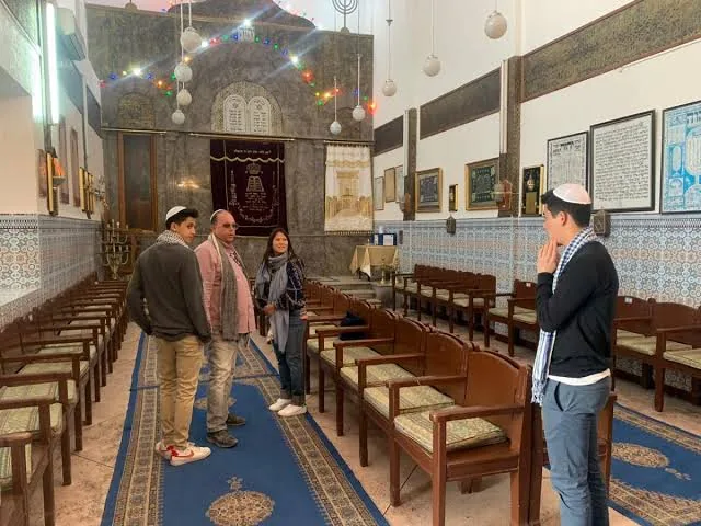 Visitors inside the Slat al-Azama synagogue in the Marrakech Mellah