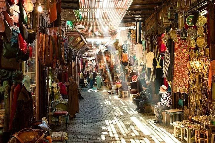Sunbeams falling through a covered souk alley in the Marrakech medina