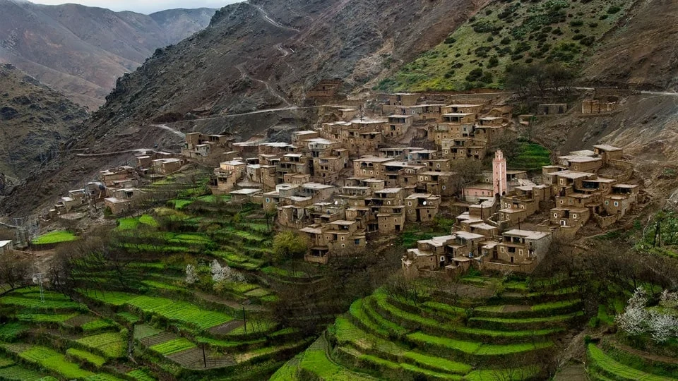 Berber village and green farming terraces in the Imlil valley