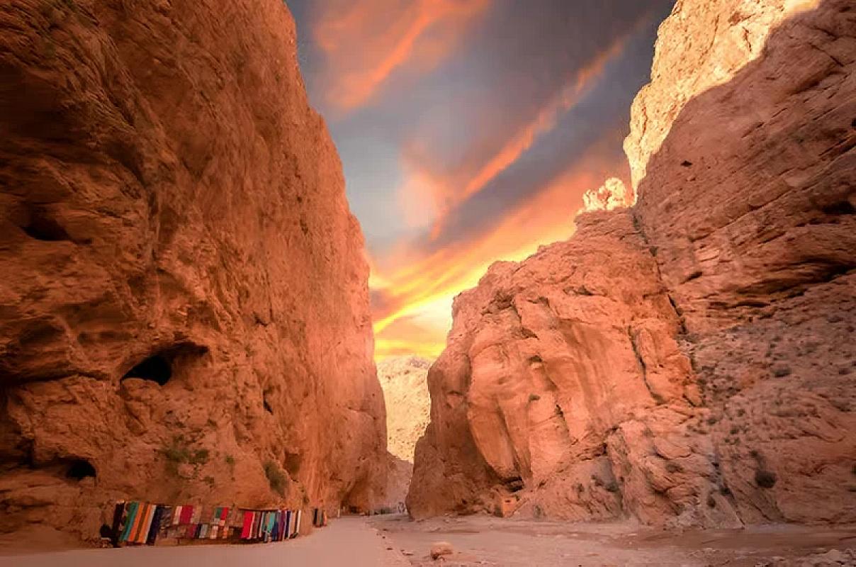 Carpet stalls beneath the towering walls of the Todra gorge