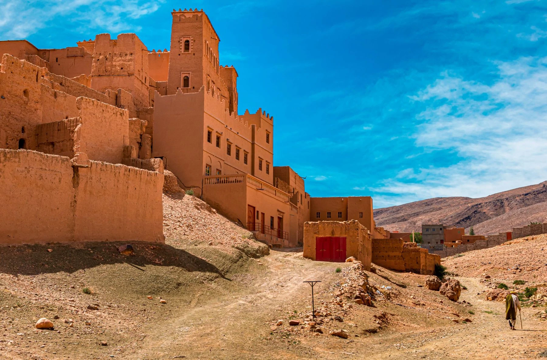 Earthen kasbah village on the desert route through the Draa valley