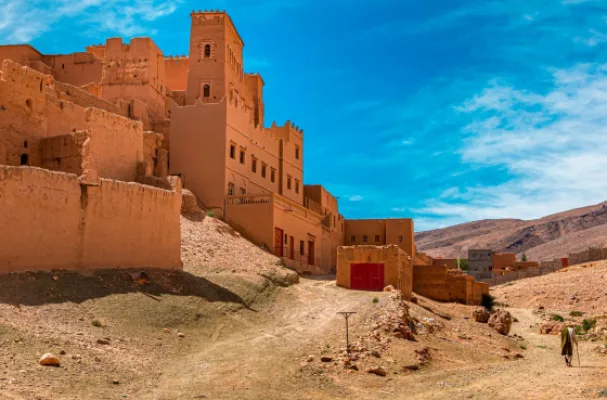 Earthen kasbah village on the desert route through the Draa valley