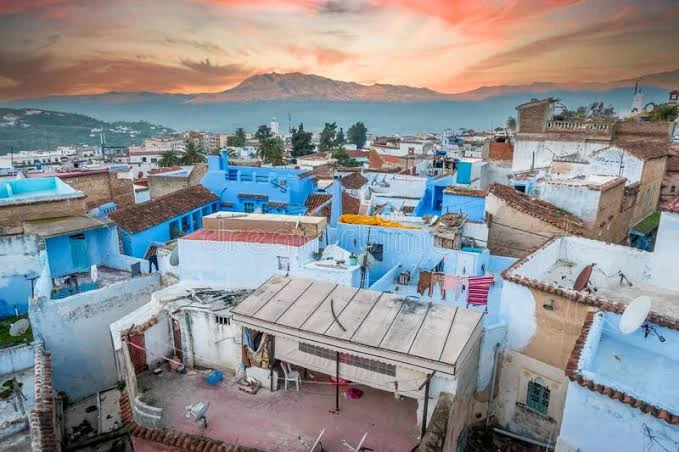 Blue rooftops of Chefchaouen against the Rif mountains