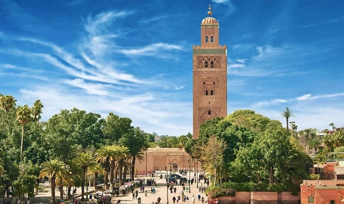 Koutoubia Mosque minaret above the trees of central Marrakech