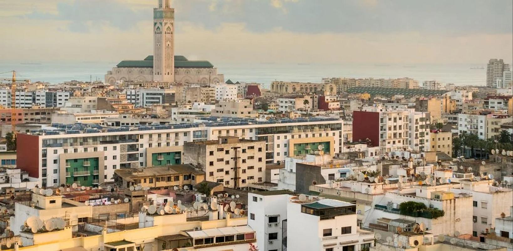 Casablanca rooftops with the Hassan II Mosque on the horizon