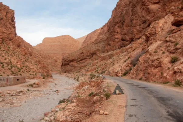 Road running through the red rock walls of the Todra gorge area